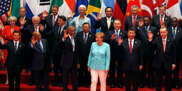 U.S. President Barack Obama, front row third from left, Chinese President Xi Jinping, second from right, and other leaders wave as they pose for a group photo session for the G-20 Summit held at the Hangzhou International Expo Center in Hangzhou in eastern China's Zhejiang province, Sunday, Sept. 4, 2016. Also pictured are Mexico's President Enrique Pena Nieto, front row left, South African President Jacob Zuma, second from left, German Chancellor Angela Merkel, third from right, Turkey's President Recep Tayyip Erdogan, right, British Prime Minister Theresa May, middle row left. (AP Photo/Ng Han Guan)