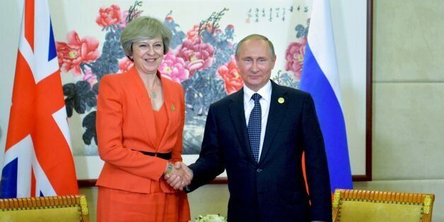 Russian President Vladimir Putin (R) meets with Britain's Prime Minister Theresa May on the sidelines of the G20 Leaders Summit in Hangzhou on September 4, 2016. / AFP / SPUTNIK / ALEXEI DRUZHININ (Photo credit should read ALEXEI DRUZHININ/AFP/Getty Images)
