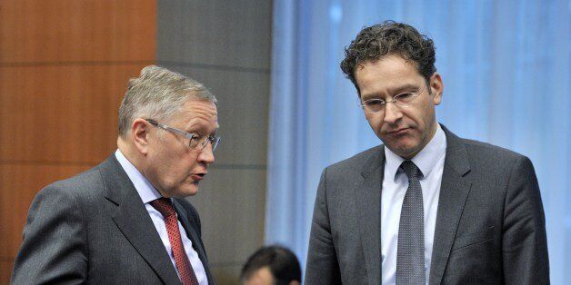 European Finacial Stability Facility Chief Executive Klaus Regling and Dutch Finance Minister and Eurozone President Jeroen Dijsselbloem (LtR) talk priorto an Eurozone Finance Ministers meeting at the EU Headquarters on January 27,2014. 'The eurozone's recovery will not be affected by contagion from growing fears over emerging economies', Eurozone chief Jeroen Dijsselbloem said. AFP PHOTO /GEORGES GOBET (Photo credit should read GEORGES GOBET/AFP/Getty Images)