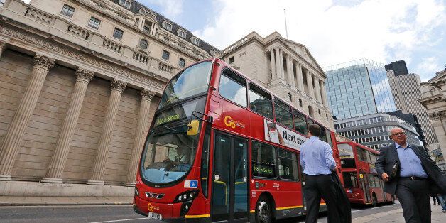 A London bus passes the Bank of England in London, Thursday, Aug. 4, 2016. The Bank of England is expected to cut interest rates close to zero and possibly inject billions in new money into the economy to help it endure the shock of the vote to leave the European Union. (AP Photo/Frank Augstein)