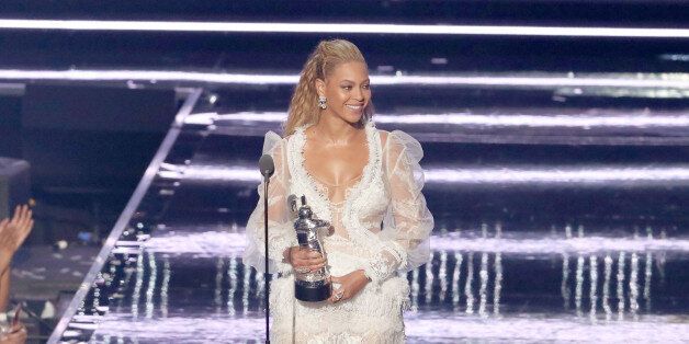 NEW YORK, NY - AUGUST 28: Beyonce accepts an award onstage during the 2016 MTV Video Music Awards at Madison Square Garden on August 28, 2016 in New York City. (Photo by Kevin Kane/FilmMagic)