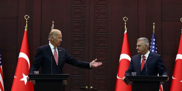 U.S Vice President Joe Biden, left, speaks to the media after talks with Turkish Prime Minister Binali Yildirim in Ankara, Turkey, Wednesday, Aug. 24, 2016. Biden called on Turkish authorities on Wednesday to be patient with the U.S. legal system as Turkey seeks the return of a cleric accused of masterminding last month's failed military coup. Biden, who met with Turkish officials in Ankara, said that the extradition process would take time as he reaffirmed Washington's cooperation in the case of U.S.-based Muslim cleric Fethullah Gulen.(AP Photo/Burhan Ozbilici)