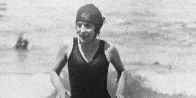 Australian professional swimmer Annette Kellerman walks out of the water on July 27, 1928 at Deauville, France in a complete black bathing suit. (AP Photo)