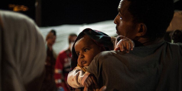 SALERNO, CAMPANIA, ITALY - 2016/08/02: Salerno landing over 800 migrants from sub-Saharan Africa, specifically they come from Somalia, Libya, Bangladesh, Ghana, Nigeria, Ivory Coast, Cameroon, Egypt, Congo and Senegal, recovered from Siem Pilot Norwegian ship. Filming rescue activities in the Strait of Sicily, where every day dozens of migrants trying to reach Italy with the help of makeshift boats. Among these a pregnant woman and a newborn. (Photo by Ivan Romano/Pacific Press/LightRocket via Getty Images)