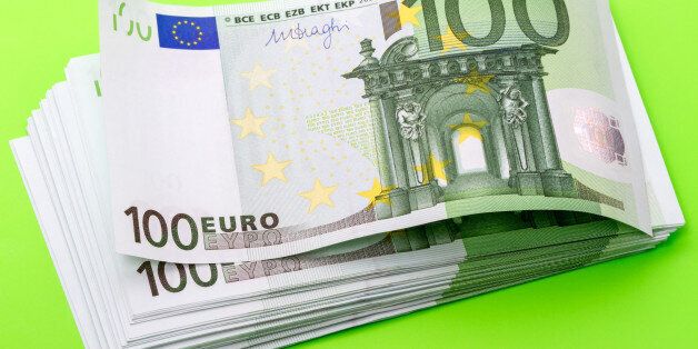 Pack of bank notes hundred euros on a green background