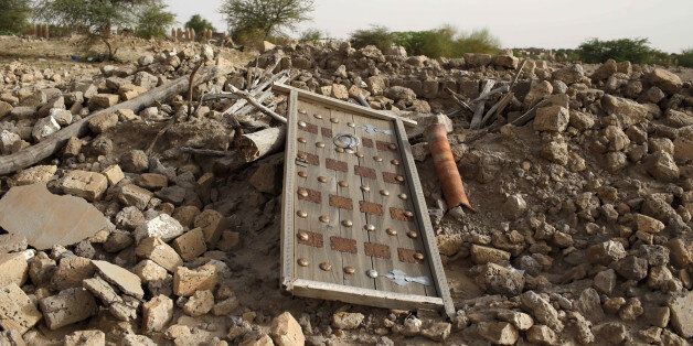 The rubble left from an ancient mausoleum destroyed by Islamist militants, is seen in Timbuktu, Mali, July 25, 2013. REUTERS/Joe Penney/File Photo