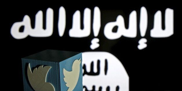 A 3D-printed Twitter logo is seen on a keyboard in front of a computer screen on which an Islamic State flag is displayed, in this picture illustration taken in Zenica, Bosnia and Herzegovina, February 6, 2016. Twitter Inc has shut down more than 125,000 terrorism-related accounts since the middle of 2015, most of them linked to the Islamic State group, the company said in a blog post on Friday. REUTERS/Dado Ruvic