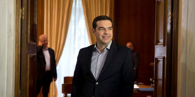 Greek Prime minister Alexis Tsipras waits the arrival of German Vice Chancellor and Economy Minister Sigmar Gabriel, prior their talks in Athens, on Thursday, June 30, 2016. (AP Photo/Petros Giannakouris)
