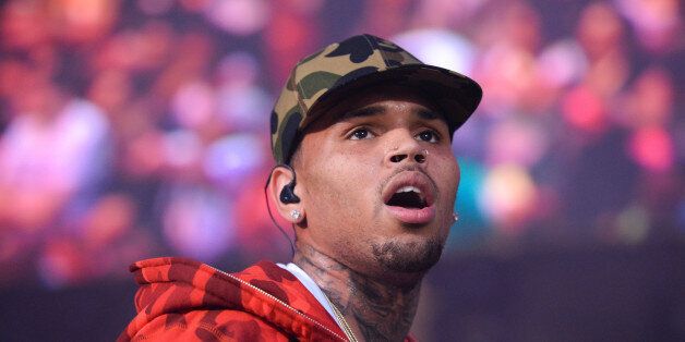FILE - In this June 7, 2015, file photo, rapper Chris Brown performs at the 2015 Hot 97 Summer Jam at MetLife Stadium in East Rutherford, N.J. Authorities said officers responded to singer Brown's Los Angeles home early Tuesday, Aug. 30, 2016, after a woman called police seeking assistance. (Photo by Scott Roth/Invision/AP, File)