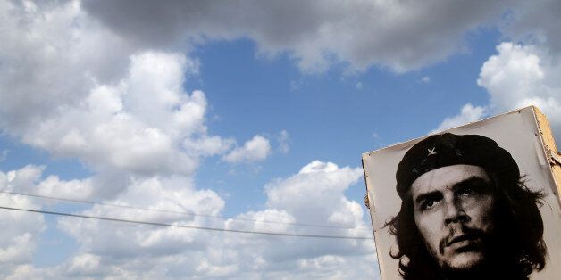 GABRIEL, CUBA - FEBRUARY 28: A poster of Revolutionary hero Che Guevara is seen next to the road a day after the second round of diplomatic talks between the United States and Cuban officials took place in Washington, DC on February 28, 2015 in Gabriel, Cuba. The dialogue is an effort to restore full diplomatic relations and move toward opening trade. (Photo by Joe Raedle/Getty Images)