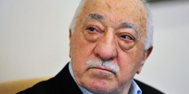 FILE - In this file photo dated Sunday July, 2016, Islamic cleric Fethullah Gulen speaks to members of the media at his compound, in Saylorsburg, Pennsylvania, USA. Turkish President Recep Tayyip Erdogan accused Gulen of orchestrating the failed military coup attempt in Turkey, by placing his followers into positions of power decades ago. Gulen denies any involvement. (AP Photo/Chris Post, FILE)