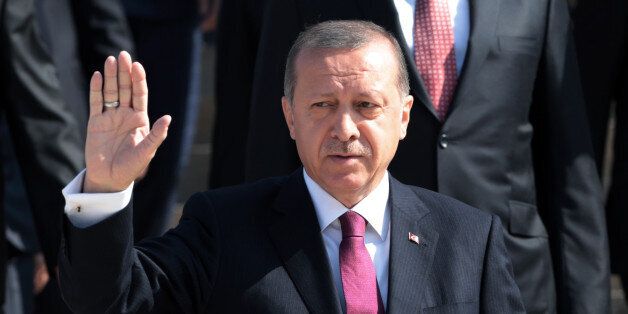 Turkish President Recep Tayyip Erdogan salutes as he visits the mausoleum of modern Turkey's founder Mustafa Kemal Ataturk on Victory Day in Ankara, Turkey, Tuesday, Aug. 30, 2016. Turkish army's 94-year-old victory over Greece was considered crucial in Turkish Independence War and the foundation of modern Turkish republic. (AP Photo/Burhan Ozbilici)