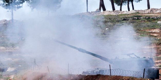 Turkish tanks fire from their army position near the Oncupinar crossing gate close to the town of Kilis, south central Turkey, towards the Syria border, on February 17, 2016. Alarmed by the advances of Syrian Kurdish forces in Aleppo province near the border, Ankara has in recent days bombed their positions, defying international calls for a halt to the strikes. / AFP / BULENT KILIC (Photo credit should read BULENT KILIC/AFP/Getty Images)