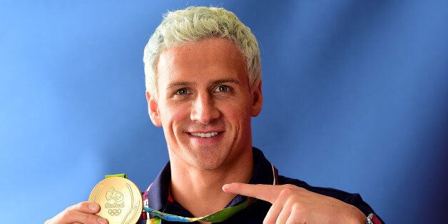 RIO DE JANEIRO, BRAZIL - AUGUST 12: (BROADCAST - OUT) Swimmer, Ryan Lochte of the United States poses for a photo with his gold medal on the Today show set on Copacabana Beach on August 12, 2016 in Rio de Janeiro, Brazil. (Photo by Harry How/Getty Images)