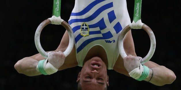 RIO DE JANEIRO, BRAZIL - AUGUST 15, 2016: Artistic gymnast Eleftherios Petrounias of Greece competes to win the men's rings final at the Rio 2016 Summer Olympic Games, at the Rio Olympic Arena. Stanislav Krasilnikov/TASS (Photo by Stanislav Krasilnikov\TASS via Getty Images)