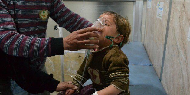IDLIB, SYRIA - APRIL 27: A Syrian boy receives treatment at a local hospital following a suspected chlorine gas attack by Asad regime forces in Jebel ez Zawiye, Idlib, Syria on April 27, 2015. (Photo by Firas Taki/Anadolu Agency/Getty Images)
