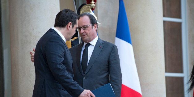 PARIS, FRANCE - APRIL 13: French President Francois Hollande (R) escorts the Greek Prime Minister, Alexis Tsipras (L) after their meeting at Elysee Palace on April 13, 2016 in Paris, France. The leaders discussed the refugee and Greek debt crises. (Photo by Aurelien Meunier/Getty Images)