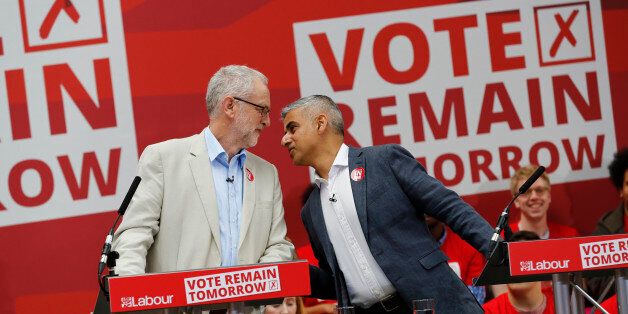 Labour Party leader Jeremy Corbyn (L) and London Mayor Sadiq Khan speak during a