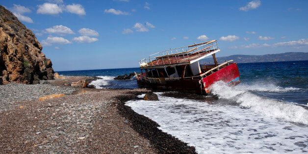 SKALA KAMINASI, GREECE - 19 JULY: The wrecked remains of a ship lie on the shore on the beach of Skala Kaminas which was used by refugees to cross Aegean sea from Turkey to Greece last year on July 19, 2016 in Skala Kaminas, Lesvos Island, Greece.The increase in refugees arriving on the island of Lesvos last year has seriously effected tourism, with the number of tourists falling more than 70% this year so far. (Photo by Milos Bicanski/Getty Images)