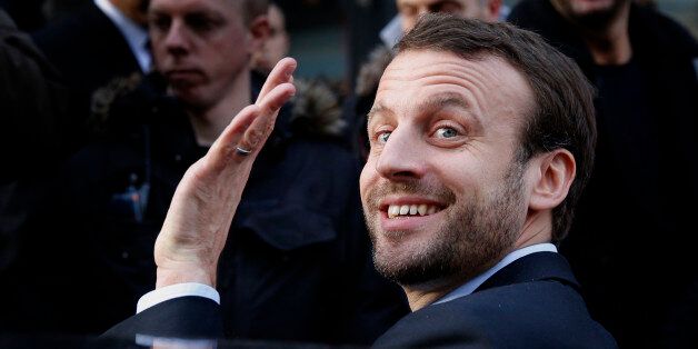 FILE - In this Jan.6, 2016 file photo, French Economy Minister Emmanuel Macron waves as he leaves after a visit to a shopping center. Macron, an outspoken former investment banker who has encouraged start-ups and more labor flexibility, has quit the socialist government Tuesday Aug. 30, 2016 amid speculation that he is considering a presidential bid. (AP Photo/Christophe Ena; File)