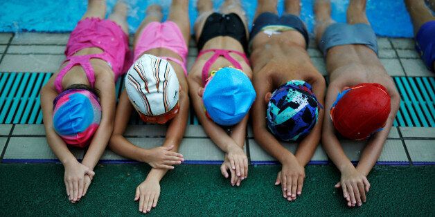 Children attend a swim training session at Hangzhou Chen Jinglun Sport school Natatorium, where Chinese Olympic swimmer Sun Yang and Fu Yuanhui also trained, in Hangzhou, Zhejiang province, China, August 10, 2016. REUTERS/Aly Song