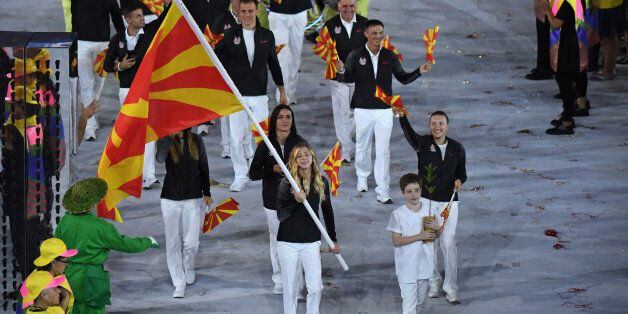 Macedonia's flagbearer Anastasia Bogdanovski leads her delegation during the opening ceremony of the Rio 2016 Olympic Games at the Maracana stadium in Rio de Janeiro on August 5, 2016. / AFP / PEDRO UGARTE (Photo credit should read PEDRO UGARTE/AFP/Getty Images)