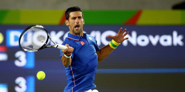 RIO DE JANEIRO, BRAZIL - AUGUST 07: Novak Dokovic of Serbia in action against Juan Martin Del Potro of Argentina in their singles match on Day 2 of the Rio 2016 Olympic Games at the Olympic Tennis Centre on August 7, 2016 in Rio de Janeiro, Brazil. (Photo by Clive Brunskill/Getty Images)