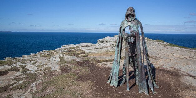 TINTAGEL, UNITED KINGDOM - APRIL 28: The new 'Gallos' sculpture that has been erected at Tintagel Castle is seen in Tintagel on April 28, 2016 in Cornwall, England. The English Heritage managed site and the nearby town have long been associated with the legend of King Arthur and continue to attract large visitor numbers. However, efforts by English Heritage to update the visitor experience with the Gallos sculpture, along with a rock carving of Merlin's face, which English Heritage say are inspired by the legend of King Arthur and Tintagel Castles royal past, have met with criticism from some Cornish nationalists and historians. (Photo by Matt Cardy/Getty Images)