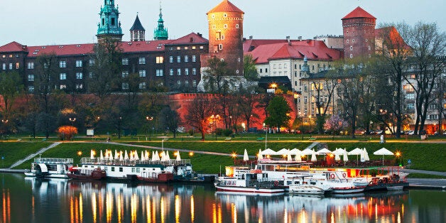 Gothic Royal Castle and cathedral on Wawel hill overlooking River Vistula at dusk. Built on the behest of 'Casimer 3rd the great' around the 14th Century