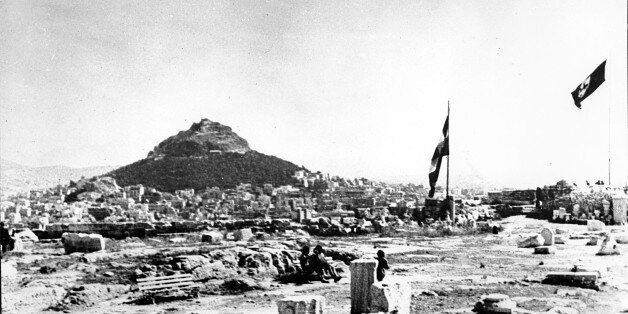 The Nazi flag with its swastika symbol, right, flies beside the flag of Greece on the Acropolis in Athens on May 27, 1941 during World War II. The conquering German forces planted their flag amid the ancient ruins on April 28. (AP Photo)