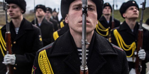 SEVASTOPOL, CRIMEA - MARCH 18: Soldiers of the honor guard prepare to march as people celebrate the first anniversary of the signing of the decree on the annexation of the Crimea by the Russian Federation, on March 18, 2015 in Sevastopol, Crimea. Crimea, an internationally recognised Ukrainian territory with special status, was annexed by the Russian Federation on March 18, 2014. The annexation, which has been widely condemned, took place in the aftermath of the Ukranian revolution. (Photo by Alexander Aksakov/Getty Images)