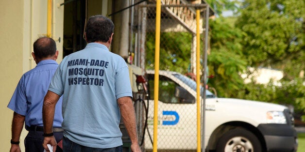 Miami-Dade mosquito control workers prepare to search homes for the Aedes aegypti mosquito in Miami, Florida, on June 08, 2016. Of the forty different types of mosquito found in Miami -Dade the Aedes aegypti mosquito or yellow fever mosquito is responsible for transmitting diseases such as the Zika Virus. / AFP / RHONA WISE / TO GO WITH AFP STORY by Leila MACOR, 'Florida health warriors deploy in war on Zika' (Photo credit should read RHONA WISE/AFP/Getty Images)