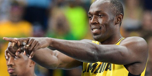 Jamaica's Usain Bolt gestures in the Men's 100m Semifinal during the athletics event at the Rio 2016 Olympic Games at the Olympic Stadium in Rio de Janeiro on August 14, 2016. / AFP / FRANCK FIFE (Photo credit should read FRANCK FIFE/AFP/Getty Images)