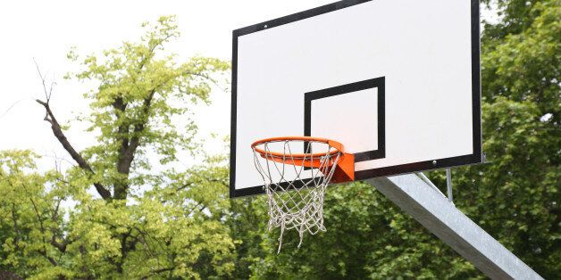An empty basketball hoop in a London park