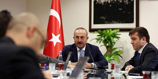 Turkey's Foreign Minister Mevlut Cavusoglu, center, speaks to the journalist during a press conference in Ankara, Turkey, on Friday, July 29, 2016. Cavusoglu said