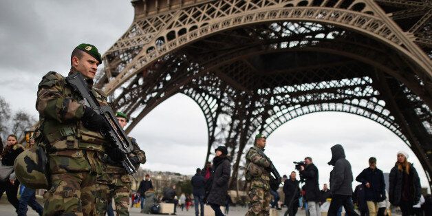 PARIS, FRANCE - JANUARY 12: French troops patrol around the Eifel Tower on January 12, 2015 in Paris, France. France is set to deploy 10,000 troops to boost security following last week's deadly attacks while also mobilizing thousands of police to patrol Jewish schools and synagogues. (Photo by Jeff J Mitchell/Getty Images)