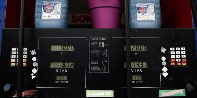 A fuel dispenser displays litres and litre prices of unleaded gasoline at an Aegean Oil gas station in Athens February 10, 2015. Stock indexes worldwide slipped on Monday on fears of Greece leaving the euro zone and concerns over conflict in Ukraine, while oil prices surged after an optimistic demand forecast from OPEC. REUTERS/ Alkis Konstantinidis (GREECE - Tags: POLITICS BUSINESS ENERGY COMMODITIES)