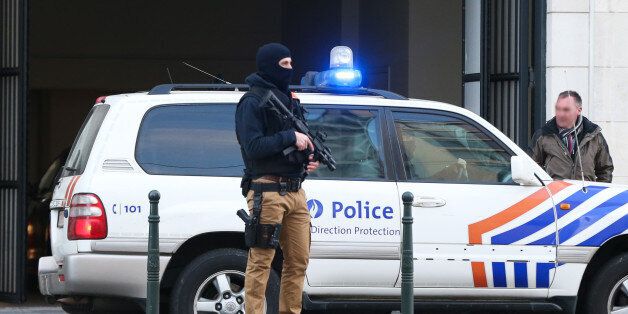 Police stand outside the council chamber in Brussels on April 7, 2016 during the appearance of Salah Abdeslam, the sole surviving suspect in the November 13 Paris attacks, along with two other suspects arrested on March 18.Extraditing Paris terror suspect Salah Abdeslam from Belgium to France is likely to take 'several weeks,' as investigators question him about a shootout with police in Brussels last month, his lawyer Sven Mary said on April 7. / AFP / BELGA / VIRGINIE LEFOUR / Belgium OUT (Photo credit should read VIRGINIE LEFOUR/AFP/Getty Images)