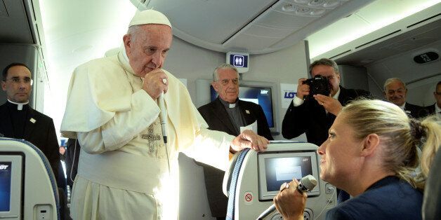 Pope Francis speaks to journalists during a press conference on the plane after his visit to Krakow, Poland, for the World Youth Days, July 31, 2016. REUTERS/Filippo Monteforte/Pool