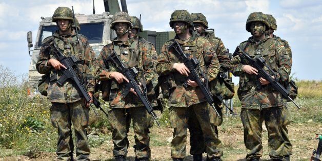 German soldiers (Bundeswehr) are pictured at a training area on August 9, 2016 in Ohrdruf. Heavily armed soldiers in Paris have been a common sight after France was hit by deadly attacks, but in neighbouring Germany, talk about troops patrolling at home for the first time since World War II has sparked an emotional debate. / AFP / dpa / Martin Schutt / Germany OUT (Photo credit should read MARTIN SCHUTT/AFP/Getty Images)