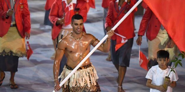 Tonga's flagbearer Pita Nikolas Taufatofua leads his delegation during the opening ceremony of the Rio 2016 Olympic Games at the Maracana stadium in Rio de Janeiro on August 5, 2016. / AFP / OLIVIER MORIN (Photo credit should read OLIVIER MORIN/AFP/Getty Images)