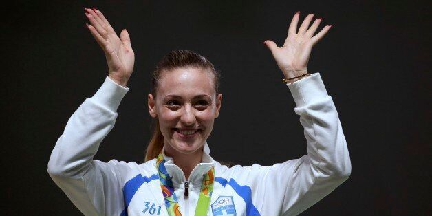 2016 Rio Olympics - Shooting - Victory Ceremony - Women's 10m Air Pistol Victory Ceremony - Olympic Shooting Centre - Rio de Janeiro, Brazil - 07/08/2016. Anna Korakaki (GRE) of Greece celebrates after winning the bronze medal. REUTERS/Edgard Garrido FOR EDITORIAL USE ONLY. NOT FOR SALE FOR MARKETING OR ADVERTISING CAMPAIGNS.