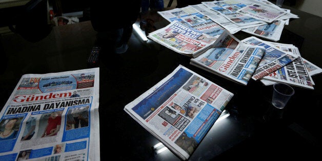 A journalist of pro-Kurdish Ozgur Gundem gives an interview to a German TV channel at their newsroom before a protest against the arrest of three prominent campaigners for press freedom, in front of the pro-Kurdish Ozgur Gundem newspaper in central Istanbul, Turkey, June 21, 2016. REUTERS/Murad Sezer