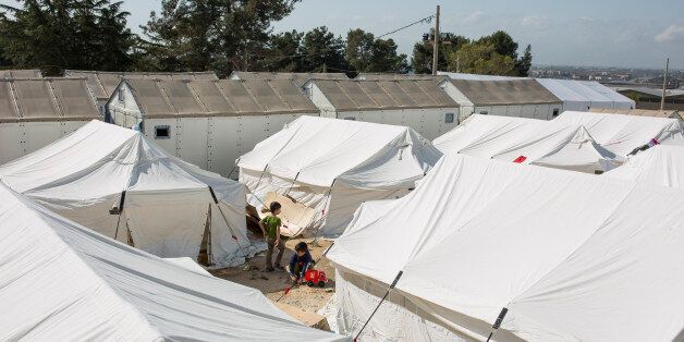 THESSALONIKI, GREECE - MARCH 07: Children play amongst tents at the Diavata refugee relocation centre near Thessaloniki on March 07, 2016 in Diavata, Greece. Relocation centres around the northern city of Thessaloniki are continuing to home many refugees though remain largely empty as people push north conscious of the prospect of the border closing permanently. Doctors are warning that conditions at the Idomeni camp close to the Macedonian border are becoming dangerous for children, with medics dealing with a range of illnesses, including hypothermia. The transit camp at the border is becoming increasingly overcrowded as thousands of refugees continue to arrive from Athens and the Greek Islands. Macedonia's border with Greece remains 'open' but after allowing 580 refugees a day to cross into the country at the beginning of the week, the numbers passing have fallen dramatically with only a handful every day. According to local authorities approximately 12,000 refugees and migrants now remain stuck at the border as they wait to enter Macedonia to continue their journey North into Western Europe. (Photo by Dan Kitwood/Getty Images)