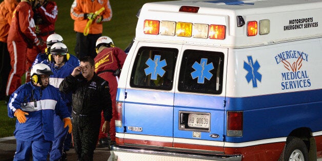 HAMPTON, GA - AUGUST 31: Jeff Green, driver of the #14 Hefty / Reynolds Toyota, walks to the ambulance after crashing during the NASCAR Nationwide Series Great Clips/Grit Chips 300 at Atlanta Motor Speedway on August 31, 2013 in Hampton, Georgia. (Photo by Patrick Smith/Getty Images)