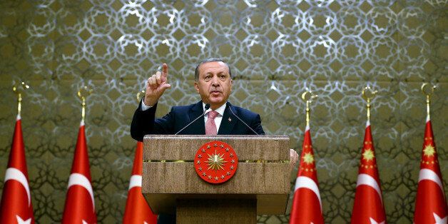 Turkey's President Recep Tayyip Erdogan speaks during an event for foreign investors, in Ankara, Turkey, on Tuesday, Aug. 2, 2016. Erdogan said, once more blasted unnamed Western countries which he says supported an attempted coup on July 15 which left more than 270 people dead.