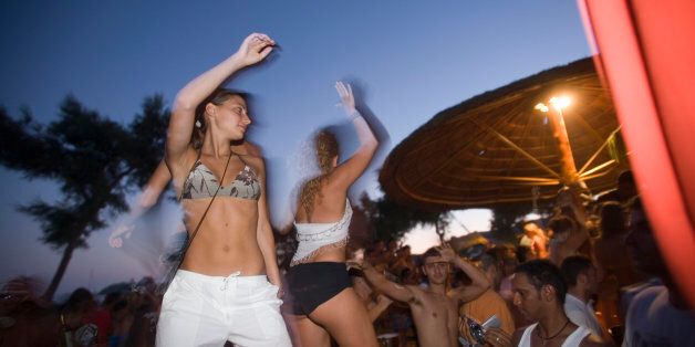Young people dancing during a beach party of the Tropicana Club, Paradise Beach, Mykonos, Greece