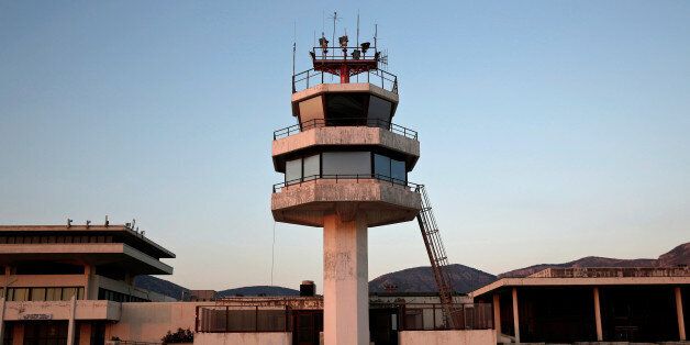 An auxiliary control tower stands in front of the east terminal of the former Athens International airport, Hellenikon, Greece June 16, 2014. REUTERS/Yorgos Karahalis/File photo