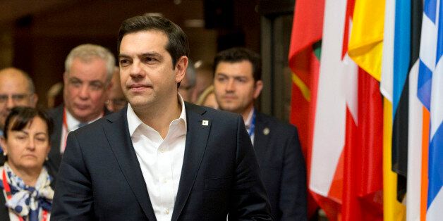 Greek Prime Minister Alexis Tsipras, center, leaves an EU summit in Brussels on Friday, March 18, 2016. European Union leaders struggled to reach a deal Thursday that balanced their concerns about refugee law and Turkeyâs human rights record with their desperation to halt the migrant crisis. (AP Photo/Virginia Mayo)