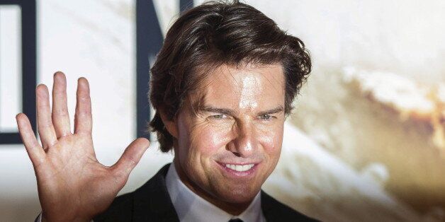 U.S. actor Tom Cruise poses for photographers at a British screening of the film